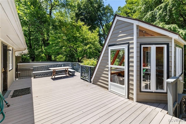 7800 Wood Rd, Henrico, VA 23229 - wooden terrace featuring an outdoor structure and view of wooded area