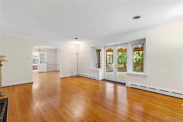 7800 Wood Rd, Henrico, VA 23229 - unfurnished room featuring a baseboard radiator, hardwood / wood-style floors, arched walkways, a chandelier, and ornamental molding