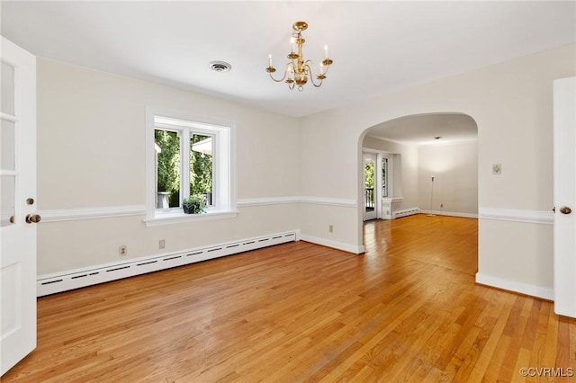 7800 Wood Rd, Henrico, VA 23229 - spare room featuring a baseboard radiator, arched walkways, light wood-style flooring, and a chandelier