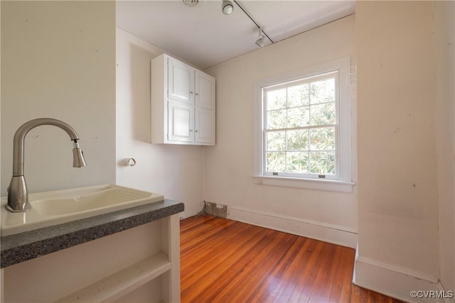 1602 Brandon Ave, Petersburg, VA 23805 - washroom featuring hardwood / wood-style floors and track lighting