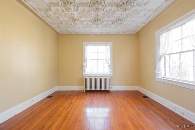 1602 Brandon Ave, Petersburg, VA 23805 - spare room with radiator and wood-type flooring