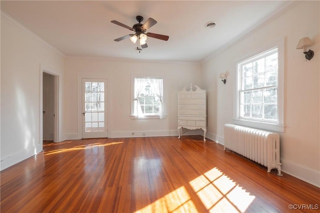 1602 Brandon Ave, Petersburg, VA 23805 - empty room with radiator heating unit, hardwood / wood-style floors, ornamental molding, and a ceiling fan