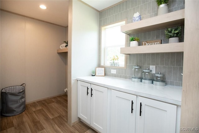 12 Sunset Ln, Rice, VA 23966 - bar area featuring decorative backsplash, light wood-style floors, and ornamental molding