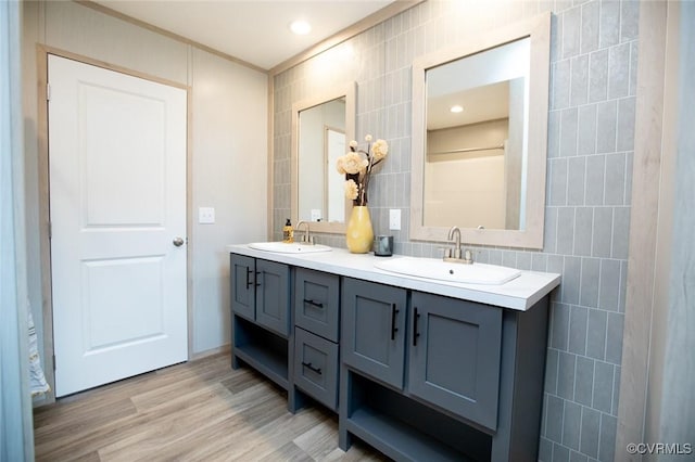 12 Sunset Ln, Rice, VA 23966 - bathroom with tile walls, double vanity, wood finished floors, crown molding, and tasteful backsplash