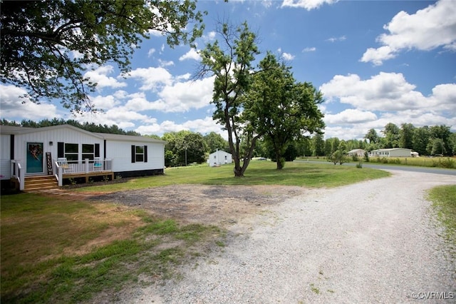 12 Sunset Ln, Rice, VA 23966 - view of grassy yard with a deck and gravel driveway