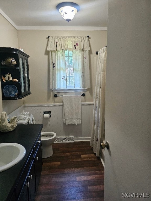 5403 Chesdin Rd, North Dinwiddie, VA 23803 - full bath with a wainscoted wall, vanity, wood finished floors, crown molding, and a shower with shower curtain