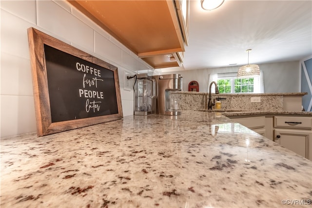 4672 Bell Rd, Powhatan, VA 23139 - kitchen with light stone countertops, decorative backsplash, white cabinetry, and decorative light fixtures