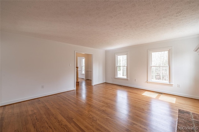 6924 Longview Dr, New Kent, VA 23141 - spare room with a textured ceiling, wood finished floors, and crown molding