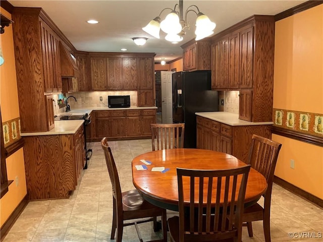 2458 Happy Hill Ln, Mechanicsville, VA 23111 - kitchen featuring black appliances, backsplash, a chandelier, light countertops, and recessed lighting