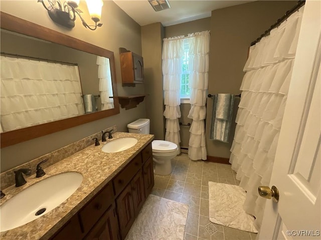2458 Happy Hill Ln, Mechanicsville, VA 23111 - full bath with double vanity and a baseboard heating unit