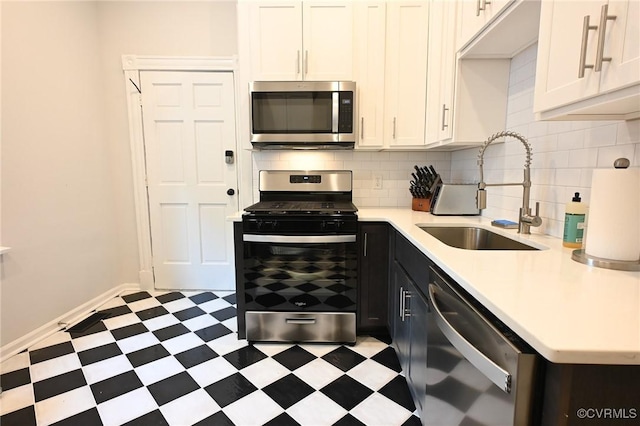7 N Davis Ave, Richmond, VA 23220 - kitchen featuring appliances with stainless steel finishes, light flooring, light countertops, and backsplash