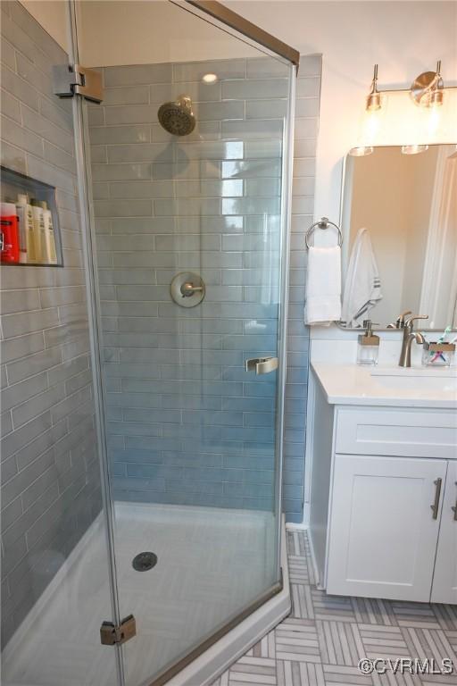 7 N Davis Ave, Richmond, VA 23220 - bathroom with a shower stall, vanity, and tile patterned floors