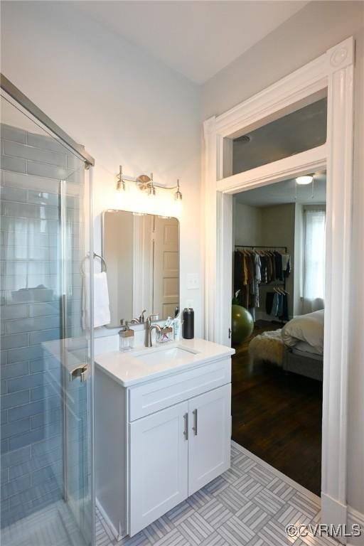 7 N Davis Ave, Richmond, VA 23220 - full bathroom featuring vanity, a stall shower, and a walk in closet