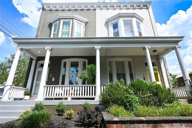 7 N Davis Ave, Richmond, VA 23220 - view of front of house with a porch and brick siding