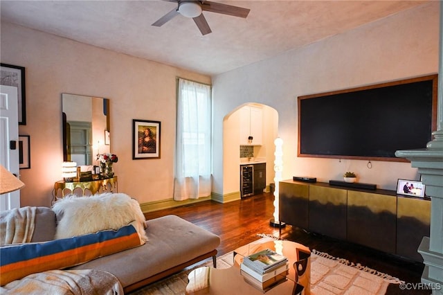 7 N Davis Ave, Richmond, VA 23220 - living room featuring arched walkways, wood finished floors, a ceiling fan, and beverage cooler