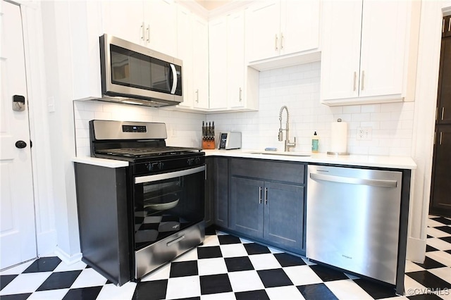 7 N Davis Ave, Richmond, VA 23220 - kitchen with stainless steel appliances, light floors, light countertops, and backsplash