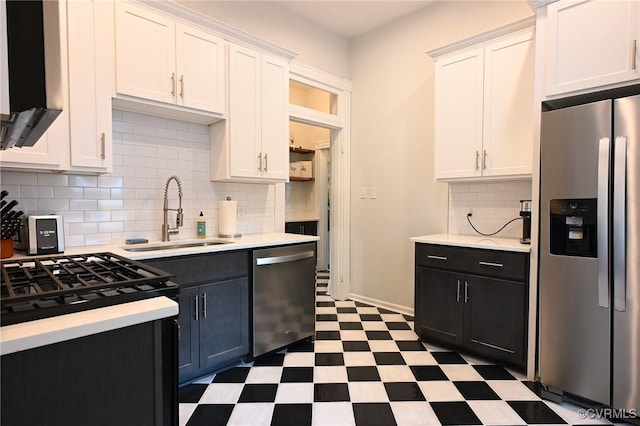7 N Davis Ave, Richmond, VA 23220 - kitchen with stainless steel appliances, tile patterned floors, light countertops, and white cabinets