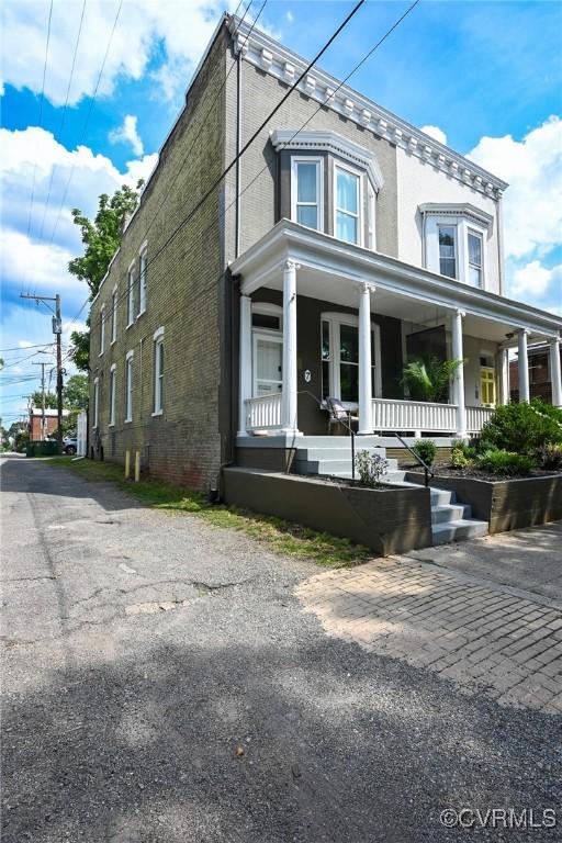7 N Davis Ave, Richmond, VA 23220 - view of front of home featuring a porch and brick siding