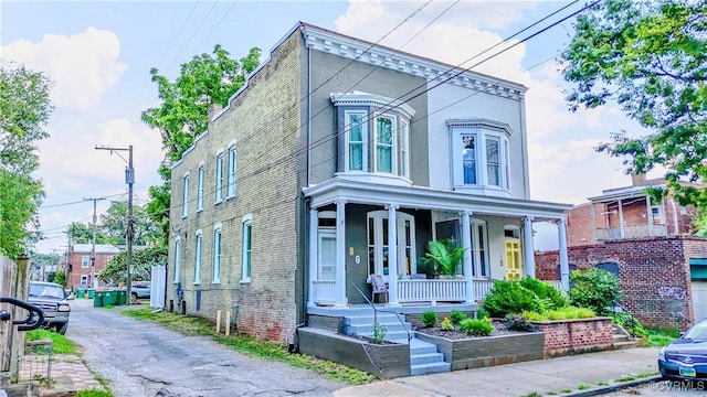 7 N Davis Ave, Richmond, VA 23220 - view of front of house featuring a porch and brick siding