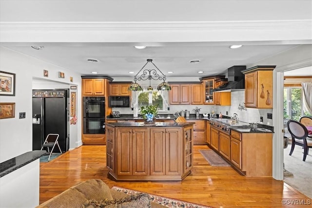 4312 Erlene Ct, Chester, VA 23831 - kitchen with black appliances, wall chimney range hood, brown cabinets, light wood finished floors, and recessed lighting