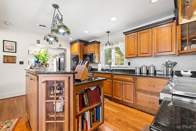 4312 Erlene Ct, Chester, VA 23831 - kitchen with black appliances, brown cabinets, light wood-style flooring, hanging light fixtures, and recessed lighting