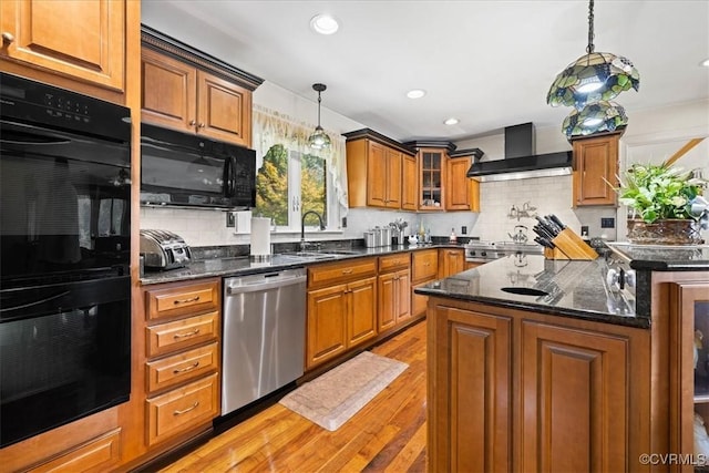 4312 Erlene Ct, Chester, VA 23831 - kitchen with black appliances, wall chimney exhaust hood, light wood-type flooring, brown cabinetry, and tasteful backsplash