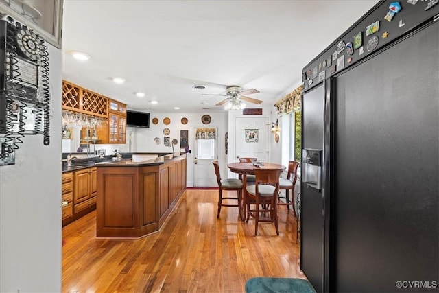 4312 Erlene Ct, Chester, VA 23831 - kitchen with refrigerator with ice dispenser, brown cabinets, light wood-style floors, dark countertops, and recessed lighting