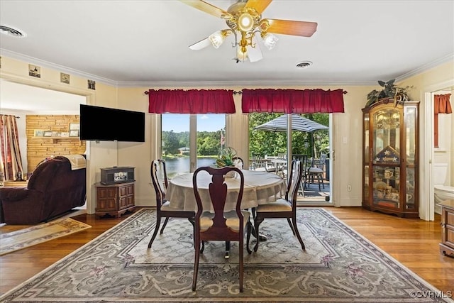 4312 Erlene Ct, Chester, VA 23831 - dining area with plenty of natural light, ornamental molding, wood finished floors, and ceiling fan