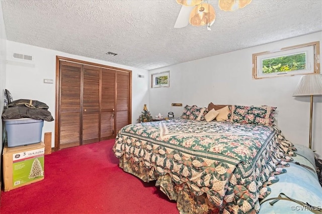 4312 Erlene Ct, Chester, VA 23831 - carpeted bedroom featuring a closet, a textured ceiling, and a ceiling fan