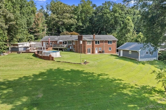 4312 Erlene Ct, Chester, VA 23831 - view of grassy yard featuring a wooden deck, an outbuilding, and view of wooded area