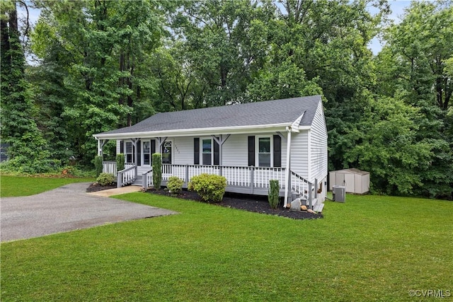 4803 White Manor Ct, Chesterfield, VA 23112 - view of front of house featuring a porch, a storage unit, a front lawn, and a shingled roof