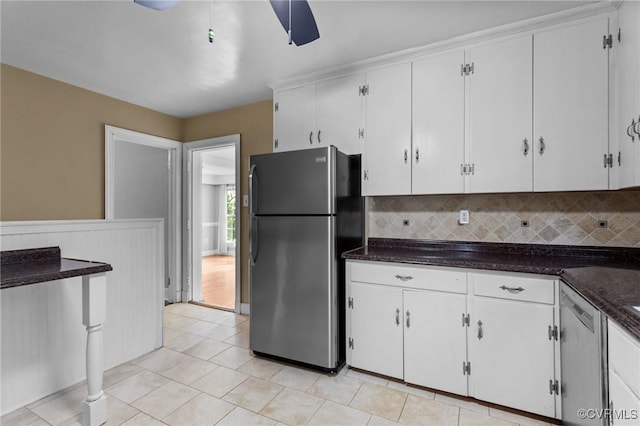 3205 Birchbrook Rd, Henrico, VA 23228 - kitchen with appliances with stainless steel finishes, white cabinets, dark countertops, backsplash, and a wainscoted wall