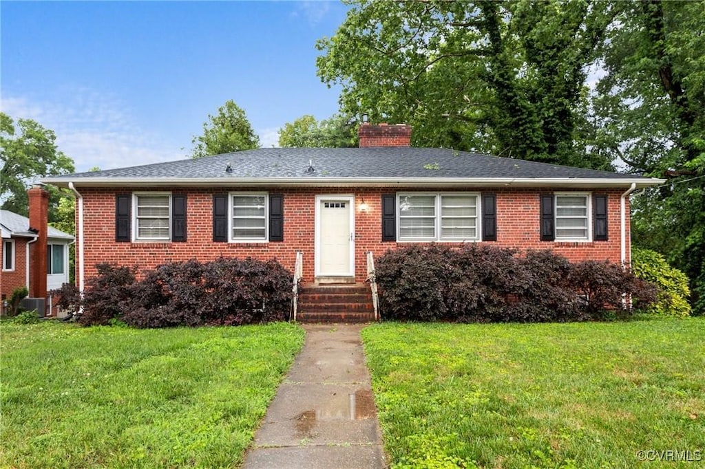 3205 Birchbrook Rd, Henrico, VA 23228 - view of front of home with a front lawn, a chimney, brick siding, and entry steps