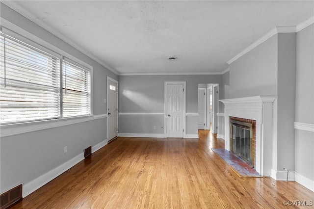 3205 Birchbrook Rd, Henrico, VA 23228 - unfurnished living room featuring light wood-style flooring, a brick fireplace, and crown molding