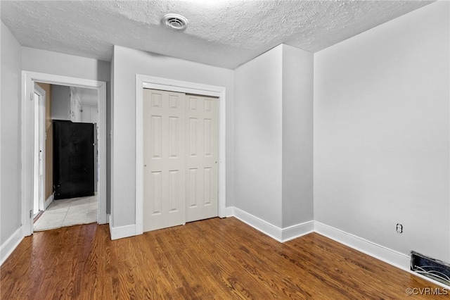 3205 Birchbrook Rd, Henrico, VA 23228 - entryway featuring a textured ceiling and wood finished floors