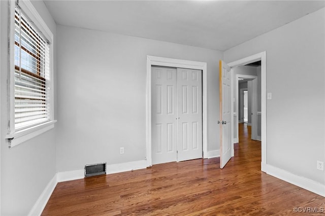 3205 Birchbrook Rd, Henrico, VA 23228 - unfurnished bedroom with wood finished floors and a closet