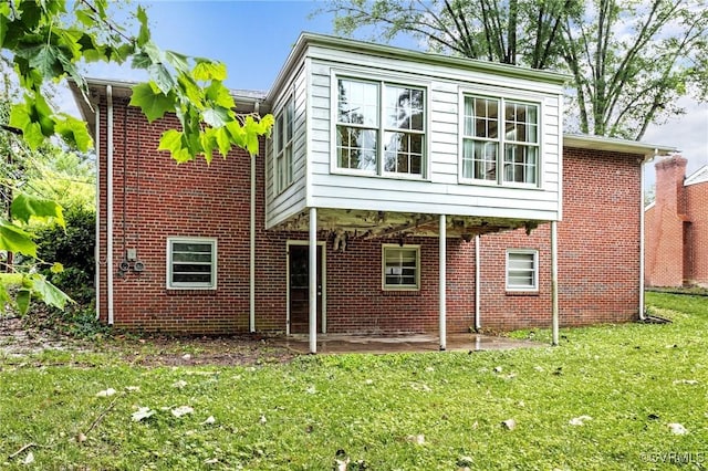3205 Birchbrook Rd, Henrico, VA 23228 - rear view of property with a yard, a patio area, and brick siding