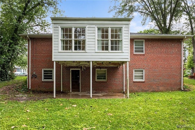 3205 Birchbrook Rd, Henrico, VA 23228 - rear view of property with a patio, a lawn, and brick siding