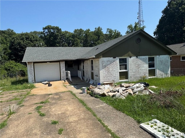 3028 Laurelbrook Dr, Richmond, VA 23224 - view of front of house with a garage, concrete driveway, brick siding, and a shingled roof