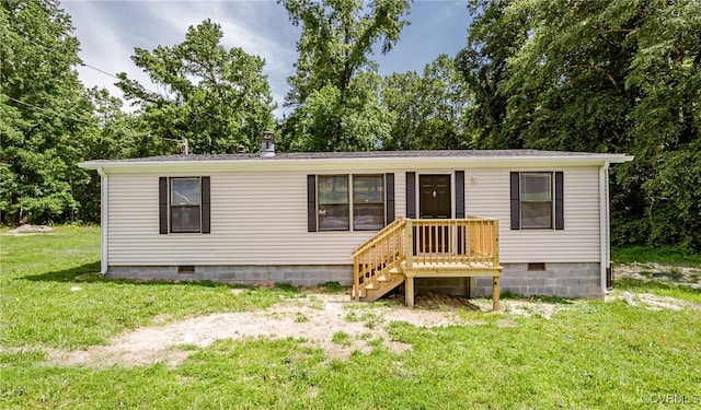 21113 River Rd, Dinwiddie, VA 23885 - manufactured / mobile home with crawl space, a front lawn, and view of scattered trees
