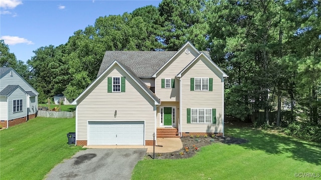 6118 Pond Grass Rd, Mechanicsville, VA 23111 - traditional-style home featuring asphalt driveway, crawl space, a front lawn, a garage, and view of scattered trees