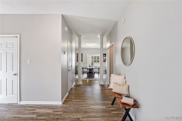 6118 Pond Grass Rd, Mechanicsville, VA 23111 - corridor with decorative columns, wood finished floors, and a textured ceiling