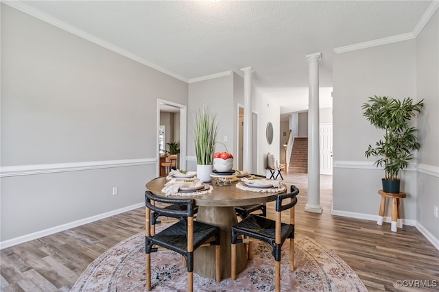 6118 Pond Grass Rd, Mechanicsville, VA 23111 - dining space featuring wood finished floors, ornate columns, and crown molding