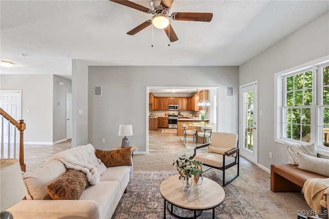 6118 Pond Grass Rd, Mechanicsville, VA 23111 - living room featuring ceiling fan, light carpet, and a textured ceiling
