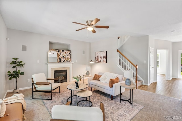 6118 Pond Grass Rd, Mechanicsville, VA 23111 - carpeted living room with stairway, a glass covered fireplace, and ceiling fan