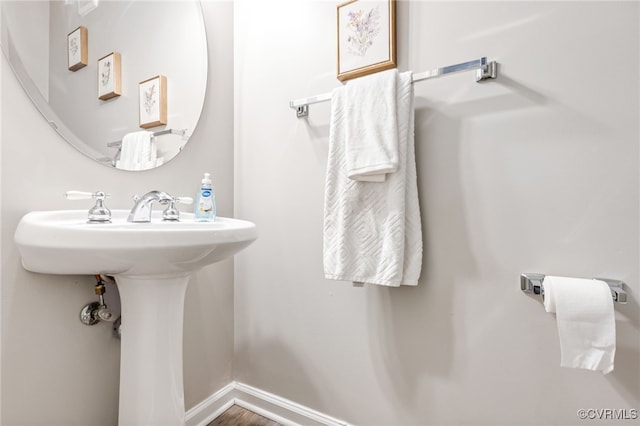 6118 Pond Grass Rd, Mechanicsville, VA 23111 - bathroom featuring a sink and wood finished floors