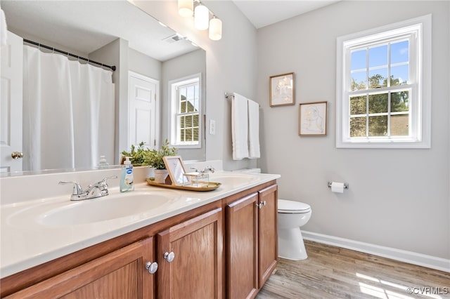 6118 Pond Grass Rd, Mechanicsville, VA 23111 - bathroom with double vanity, wood finished floors, and curtained shower