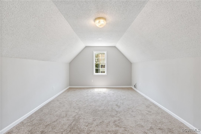 6118 Pond Grass Rd, Mechanicsville, VA 23111 - additional living space featuring a textured ceiling, carpet flooring, and vaulted ceiling