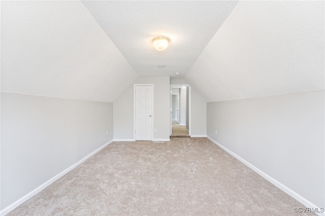 6118 Pond Grass Rd, Mechanicsville, VA 23111 - bonus room with a textured ceiling, carpet floors, and vaulted ceiling