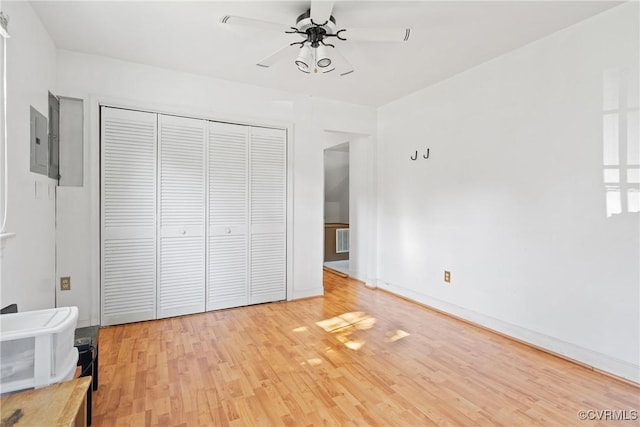 3601 Egan Rd, Chesterfield, VA 23832 - unfurnished bedroom featuring light wood finished floors, a closet, electric panel, and ceiling fan